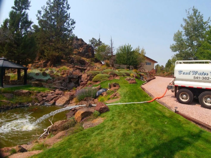 Image of water delivery truck onsite for pond filling