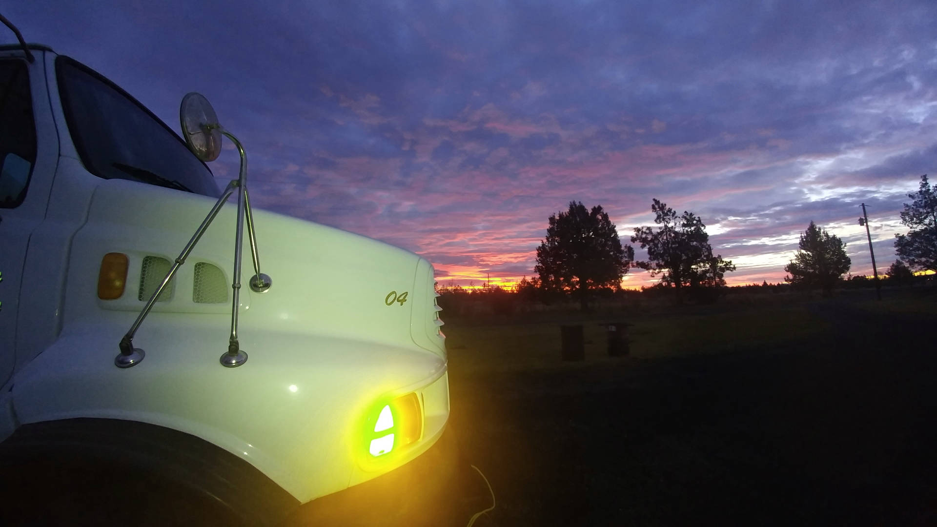 Image of water delivery truck onsite at sunset